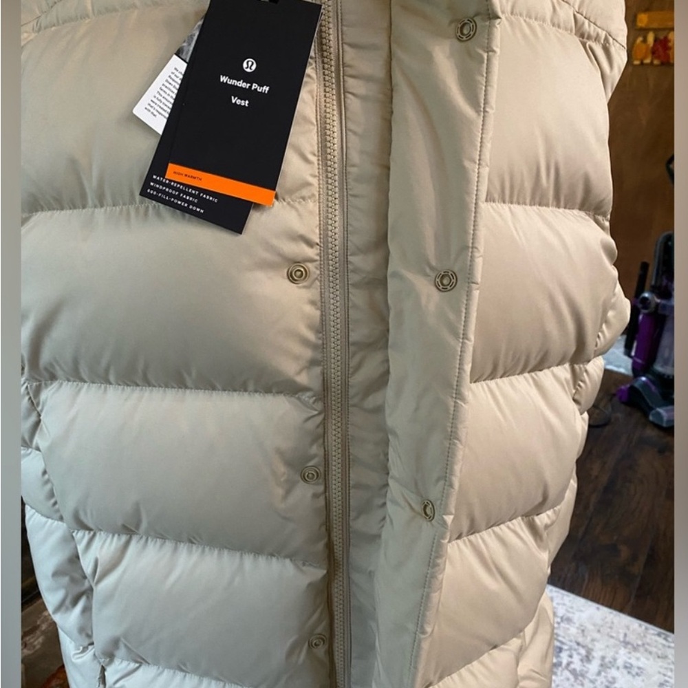 Cream puffy down vest with quilted design and warm insulation